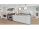 Open concept kitchen with island and high-end appliances at 4601 E Solano Dr, Phoenix, AZ 85018