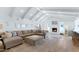 Large living room with vaulted ceilings, fireplace and sectional sofa at 4601 E Solano Dr, Phoenix, AZ 85018
