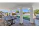 Covered patio with dining table, pool, and mountain views at 4601 E Solano Dr, Phoenix, AZ 85018