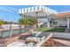 Pool area with lounge chairs and striped umbrella at 4601 E Solano Dr, Phoenix, AZ 85018