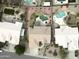 Aerial view of house and surrounding homes, showcasing a pool at 4966 E Juana Ct, Cave Creek, AZ 85331