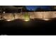 Landscaped backyard with lighting at night at 4966 E Juana Ct, Cave Creek, AZ 85331