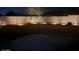 Landscaped backyard with lighting at night at 4966 E Juana Ct, Cave Creek, AZ 85331