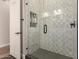 Modern bathroom with a glass shower enclosure and geometric tile at 4966 E Juana Ct, Cave Creek, AZ 85331