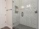 Modern bathroom with a glass shower enclosure and geometric tile at 4966 E Juana Ct, Cave Creek, AZ 85331