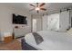 Main bedroom with ensuite bathroom and large TV at 4966 E Juana Ct, Cave Creek, AZ 85331