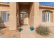 Front entry with decorative pots and a bench at 4966 E Juana Ct, Cave Creek, AZ 85331