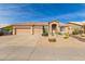 Beautiful desert landscape surrounds this single-story home with a three-car garage at 4966 E Juana Ct, Cave Creek, AZ 85331