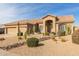 Single story home with a two-car garage and drought-tolerant landscaping at 4966 E Juana Ct, Cave Creek, AZ 85331