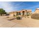 Single-story home with a two-car garage and xeriscaped front yard at 4966 E Juana Ct, Cave Creek, AZ 85331
