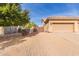 Side yard view of a home with a wooden fence and gravel landscaping at 4966 E Juana Ct, Cave Creek, AZ 85331