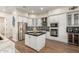 Modern kitchen with a large island and breakfast bar at 4966 E Juana Ct, Cave Creek, AZ 85331