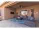 Relaxing patio furniture under covered patio with ceiling fan at 4966 E Juana Ct, Cave Creek, AZ 85331