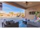 Relaxing patio with seating area, outdoor TV, and pool view at 4966 E Juana Ct, Cave Creek, AZ 85331
