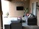Relaxing covered patio with comfortable seating and a TV at 4966 E Juana Ct, Cave Creek, AZ 85331