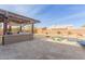 Landscaped backyard oasis with a sparkling pool and pergola at 4966 E Juana Ct, Cave Creek, AZ 85331