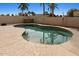 Relaxing kidney-shaped pool surrounded by a patio at 6031 E Evans Dr, Scottsdale, AZ 85254