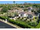 Stunning aerial view of a sprawling home with lush landscaping, pool, and palm trees in a desirable neighborhood at 6235 E Montecito Ave, Scottsdale, AZ 85251