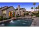 Stunning backyard with pool, spa, manicured landscaping and an outdoor kitchen at 6235 E Montecito Ave, Scottsdale, AZ 85251