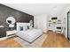 Bright bedroom featuring light walls, wood accents, and a convenient kitchenette, perfect for relaxing at 6235 E Montecito Ave, Scottsdale, AZ 85251