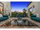 Tranquil courtyard with modern water feature, lush landscaping, ideal for outdoor dining and gatherings at 6235 E Montecito Ave, Scottsdale, AZ 85251