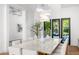 Stylish dining room with modern lighting, large table, and outdoor views at 6235 E Montecito Ave, Scottsdale, AZ 85251
