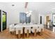 Bright dining room with a large table, modern lighting, wood floors and decor at 6235 E Montecito Ave, Scottsdale, AZ 85251