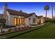 Charming single-story home with a beautifully landscaped front yard, and dark trimmed windows at 6235 E Montecito Ave, Scottsdale, AZ 85251