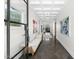 Elegant foyer with a long hallway, sleek tile floors, and stylish wall art at 6235 E Montecito Ave, Scottsdale, AZ 85251