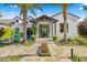 Inviting home entrance featuring a covered porch, manicured landscaping, and a stone pathway at 6235 E Montecito Ave, Scottsdale, AZ 85251