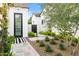 Charming front entrance featuring modern landscaping, a walkway, a gate, and a stylish door at 6235 E Montecito Ave, Scottsdale, AZ 85251