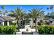 Charming home featuring a grand entrance with mature palm trees and manicured landscaping at 6235 E Montecito Ave, Scottsdale, AZ 85251