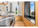 Bright kitchen features wood cabinets, stainless steel appliances, and natural light at 6235 E Montecito Ave, Scottsdale, AZ 85251