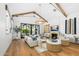 Cozy living room with vaulted ceilings, fireplace, wood beams and natural light at 6235 E Montecito Ave, Scottsdale, AZ 85251