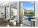 View of a courtyard from an open and airy room with large sliding glass doors at 6235 E Montecito Ave, Scottsdale, AZ 85251