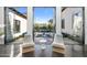 View from the living room into a beautiful courtyard with water feature and furniture at 6235 E Montecito Ave, Scottsdale, AZ 85251