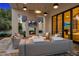 Inviting outdoor patio space, complete with fireplace, comfortable seating, and stylish lighting at 6235 E Montecito Ave, Scottsdale, AZ 85251