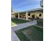 Community features a covered walkway, landscaping, and multiple large planters at 625 W Mckellips Rd # 115, Mesa, AZ 85201
