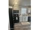 Modern kitchen with black appliances and gray cabinets at 625 W Mckellips Rd # 115, Mesa, AZ 85201