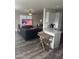 Open kitchen with granite counters, gray cabinets, and a breakfast bar at 625 W Mckellips Rd # 115, Mesa, AZ 85201