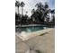 Community pool with plenty of lounge chairs and palm trees at 625 W Mckellips Rd # 115, Mesa, AZ 85201