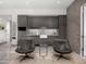 Entertaining bar area features a sink with a faucet, cabinetry, and comfortable seating at 6850 N 39Th Pl, Paradise Valley, AZ 85253