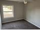 Well-lit bedroom featuring carpet and a large window at 717 W Chilton St, Chandler, AZ 85225