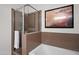 Bathroom with shower and tub, and brown tile at 7291 N Scottsdale Rd # 2009, Paradise Valley, AZ 85253