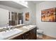 Bathroom with double sinks, shower, and granite vanity at 7291 N Scottsdale Rd # 2009, Paradise Valley, AZ 85253