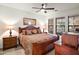 Spacious bedroom with wood furniture and large windows at 7291 N Scottsdale Rd # 2009, Paradise Valley, AZ 85253