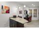 Kitchen island with granite countertop and seating for two at 7291 N Scottsdale Rd # 2009, Paradise Valley, AZ 85253