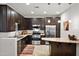 Modern kitchen with stainless steel appliances and granite countertops at 7291 N Scottsdale Rd # 2009, Paradise Valley, AZ 85253