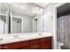 Bathroom with a double vanity and shower at 739 E Lovebird Ln, Gilbert, AZ 85297