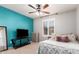Bedroom with a queen bed, dresser, and TV at 739 E Lovebird Ln, Gilbert, AZ 85297